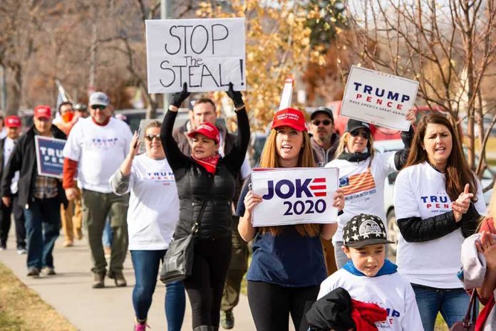 Group of protesters marching with political signs and hats