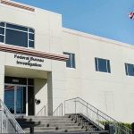 FBI office building with entrance steps and American flag