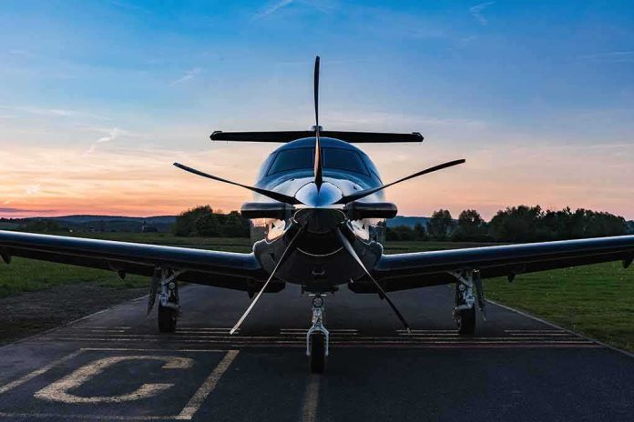 shutterstock_1914678751 Single-engine propeller airplane on runway at sunset