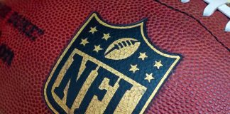 NFL Star Torches State Over DCF Custody Bomb Close-up of an NFL football with the logo prominently displayed