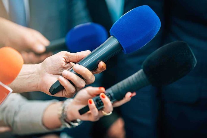 shutterstock_2168392339-5 Reporters holding colorful microphones