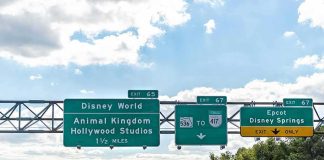 Overhead highway signs for theme park exits