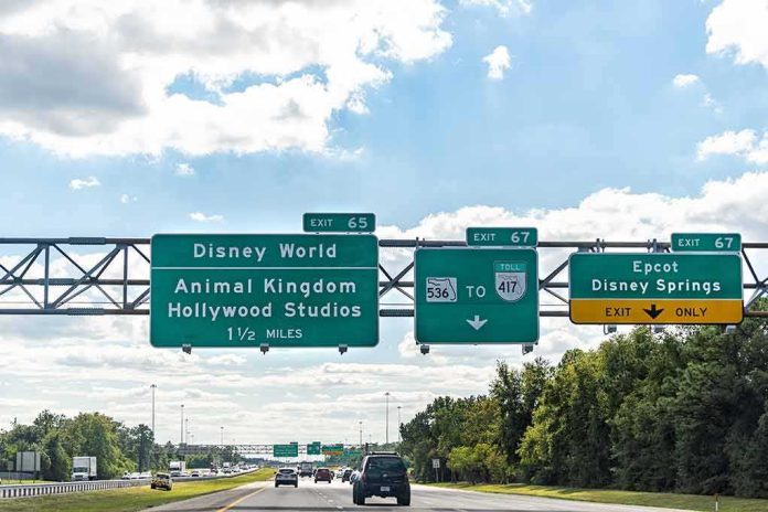 Overhead highway signs for theme park exits