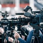 Woke Mayor Brags About Protecting Illegals Over Americans Broadcast cameras on tripods at a press event