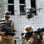 White House Terror Plot THWARTED Last-Minute! Quadcopter drone flying above soldiers in camouflage