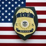 ICE officer badge on American flag background