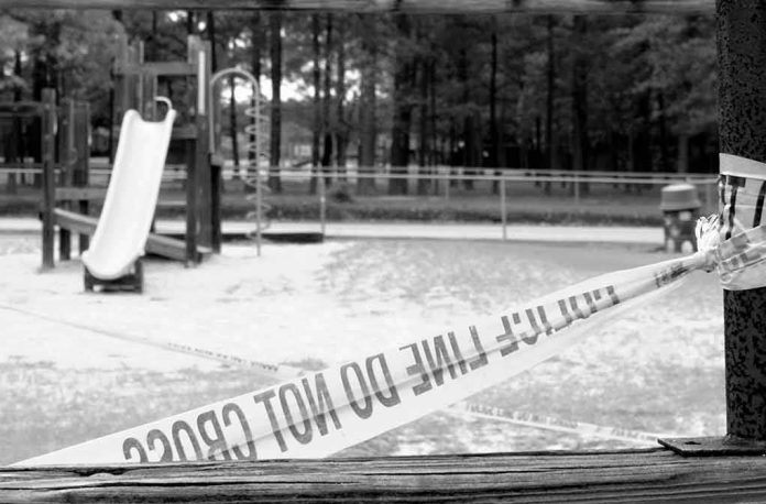 Playground closed off with caution tape in black and white