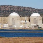 Trump Reaches Nuclear Agreement With Middle-East Country Nuclear power plant with domed structures beside a water body and mountains in the background