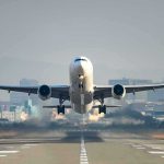 Runway Drama: Was It Tire Blow or Hydraulic Leak? An airplane taking off from an airport runway