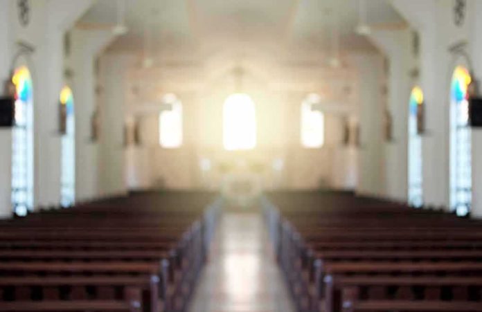 shutterstock_588868961 Empty church interior with sunlight at the altar