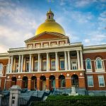 Mayor Blasted for Taxpayer Program That Discriminates Against Americans Massachusetts State House with golden dome and columns