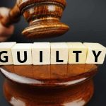 Judge's gavel above blocks spelling guilty