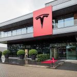 Tesla office building with large red logo sign