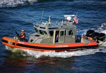U.S. Coast Guard patrol boat speeding on open water
