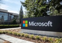 Microsoft sign outside a modern office campus