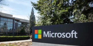 Microsoft sign outside a modern office campus