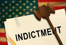 Indictment folder with gavel and pencil on American flag background
