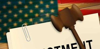 Indictment folder with gavel and pencil on American flag background