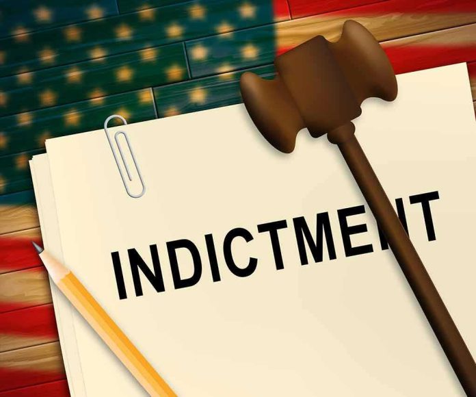 shutterstock_1435944215 Indictment folder with gavel and pencil on American flag background