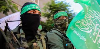 Hamas Raised Millions From New York Donors Network armed men in green headbands holding a green flag