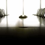 empty conference room with long table and chairs