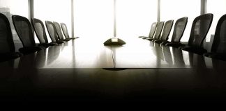 empty conference room with long table and chairs