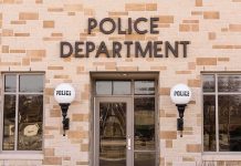 Police department building entrance with signage
