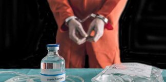 Witnesses Describe Botched Execution Chaos Handcuffed person in orange jumpsuit behind medical vials and IV equipment