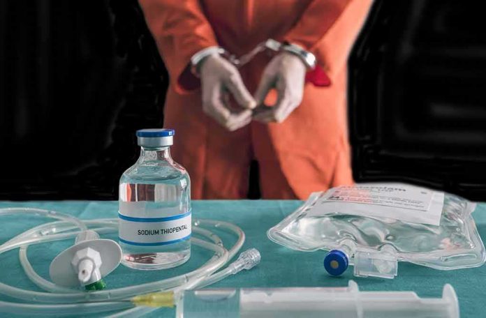 shutterstock_762356716 Handcuffed person in orange jumpsuit behind medical vials and IV equipment