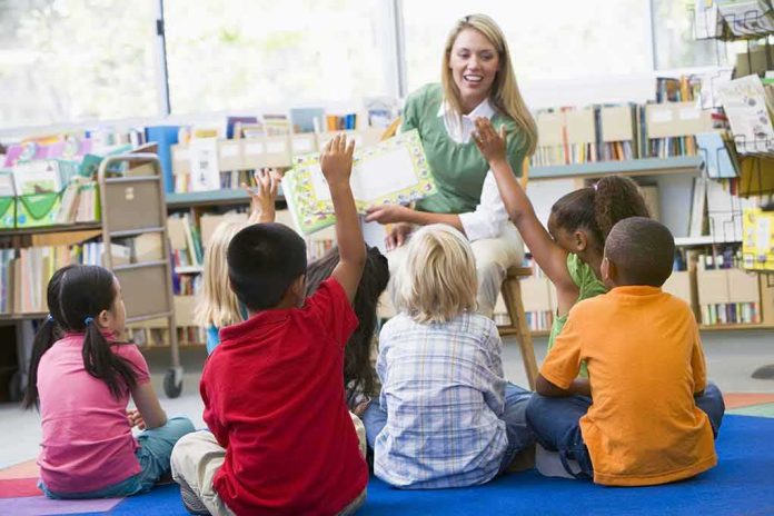 shutterstock_77123365 Teacher reading to children in a library circle